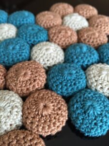 close up of crochet bottle caps
