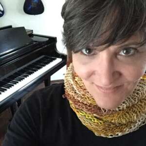 Worn as a short cowl / neck warmer.