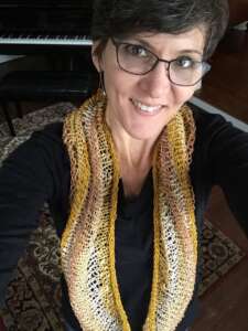 Worn as a long cowl.