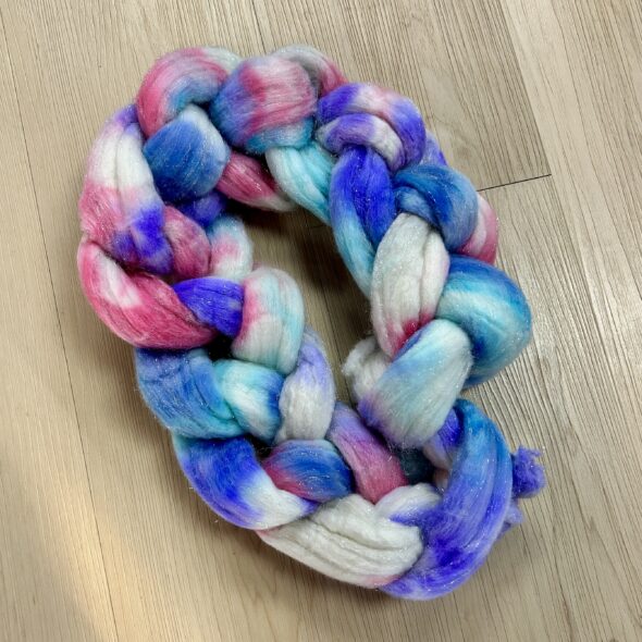 Soft pinks, purples, and aqua sparkle with Stellina in this dreamy hand-dyed Shaniko wool blend.