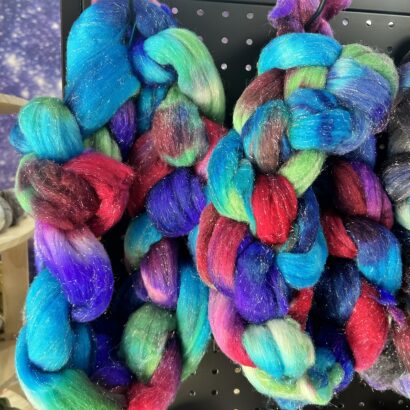 Royal Jewels – hand-dyed Little Switzerland Top by Joyous Fibers. Sparkling Shaniko wool with jewel-toned luxury. 4 oz braid, $29.